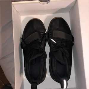Kids Nike black tennis shoes